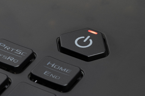 The power button is located above the others on the right. Its shape and dimensions are different, making it easily distinguishable from other buttons. In addition, it is equipped with its own red LED indicator.