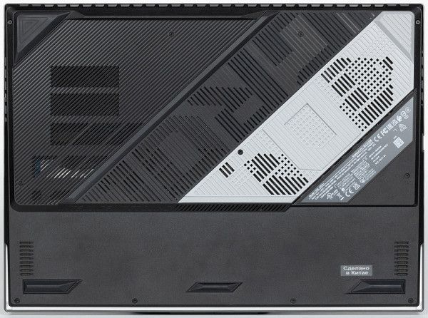 The attractiveness of the lower grille design is questionable. The air intake holes are located above both coolers and other elements that heat up while the laptop is running.