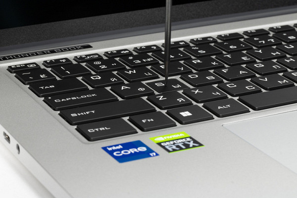 The laptop uses a membrane-type keyboard with a small (about 1.5 mm) vertical button travel.