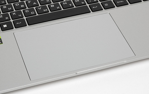 Below the keyboard is a spacious, slightly recessed touchpad measuring 140x90 mm, which does not have dedicated buttons. It responds best to pressure in the first two-thirds closer to the user, while the farthest part is less sensitive. With gestures that involve touching a surface, the touchpad works without problems.The lower part of the Thunderobot Thunderbook 16 G2 Pro laptop is secured with twelve screws, one of which is hidden under the factory sticker.