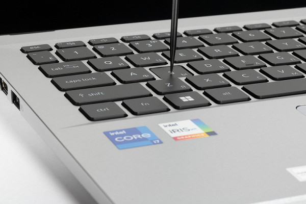 The laptop uses a membrane-type keyboard with a small (about 1.6 mm) vertical button travel.