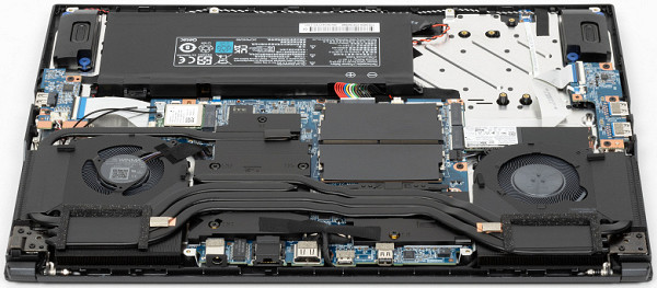 The fans capture air from the environment through holes in the bottom and blow it out through four heat exchangers. Five heat pipes remove heat from the computers, with three of them being shared between the CPU and GPU. This connects them into a common circuit, which causes synchronous rotation of the processor and video card fans under load on each of the computers separately.