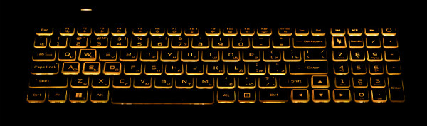 The keyboard is equipped with a backlight with three brightness levels (the fourth state is off). Brightness adjustment is carried out by repeated pressing Fn+F12 to increase and Fn+F11 to decrease. Both the characters on the keys themselves and their outlines are highlighted. The backlit area under each key is clearly visible when tilted away from the keyboard. The light distribution allows you to clearly see characters even on Russian keyboard keys.