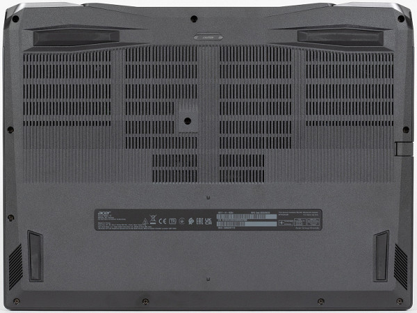 About a quarter of the bottom panel is occupied by ventilation slots, which, among other things, are located under both coolers. There are slots under the right and left speakers for sound output.