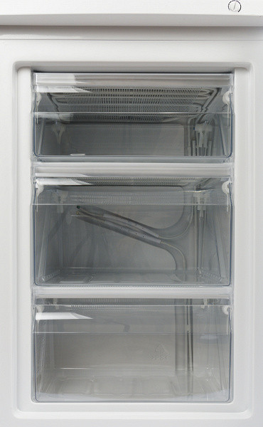 There are three drawers in the freezer. The top drawer is slightly lower than the other two, and the bottom one, behind which the refrigeration unit is located, is much shallower than the top two. Thus, the middle drawer is the most capacious.