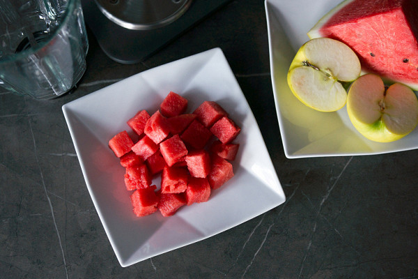 Place watermelon, ice and sour apple in a blender bowl.